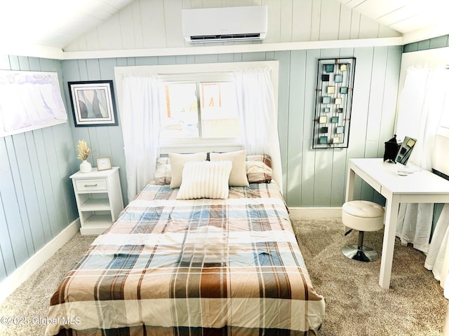 bedroom with carpet floors, lofted ceiling, baseboards, and a wall mounted AC