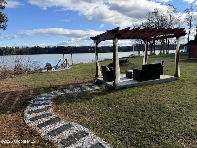 view of yard featuring a water view and a pergola