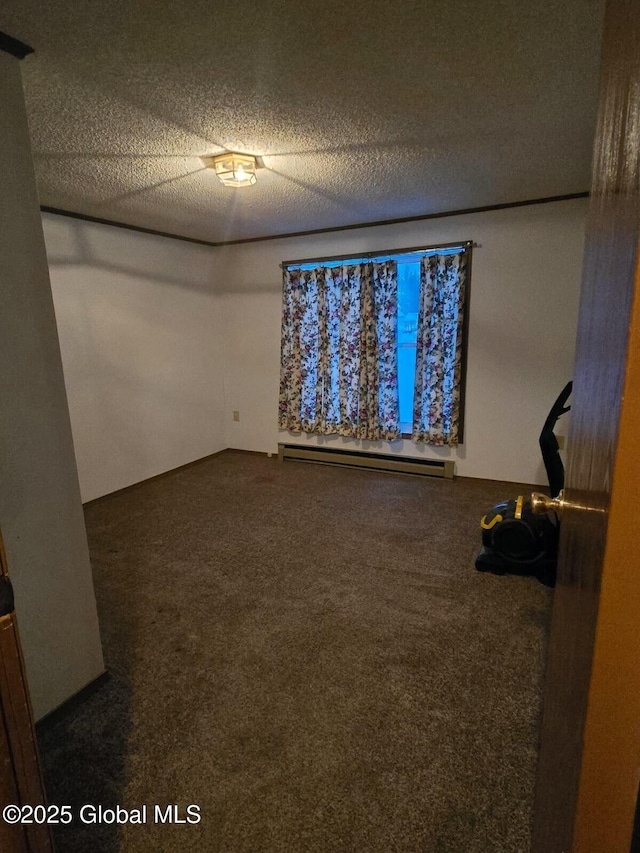 unfurnished bedroom featuring a baseboard heating unit, dark colored carpet, and a textured ceiling