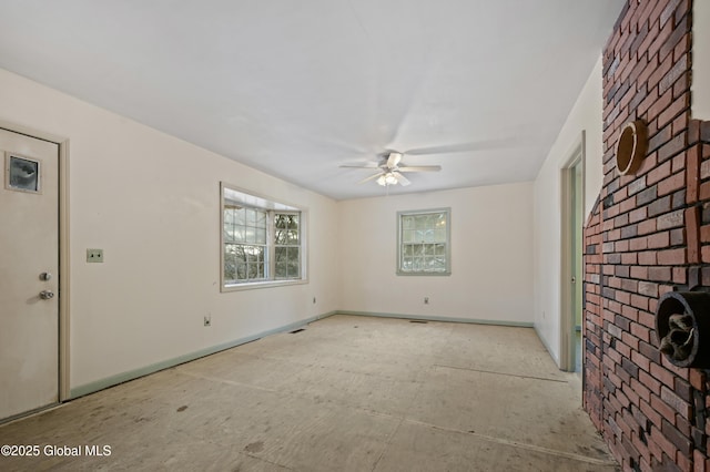 unfurnished room featuring a ceiling fan