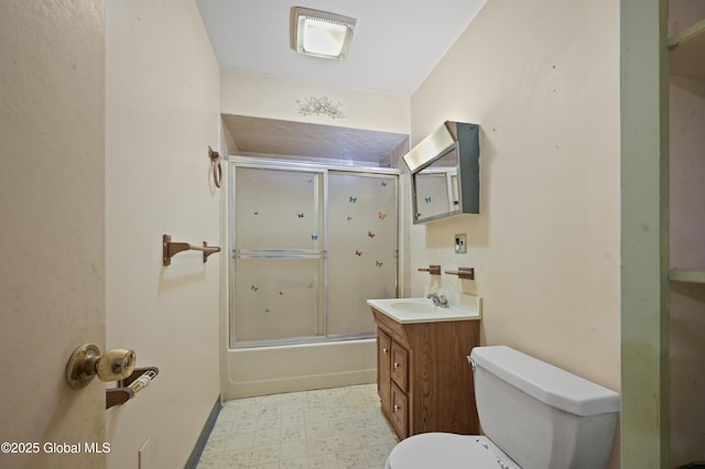 bathroom with shower / bath combination with glass door, visible vents, toilet, vanity, and tile patterned floors