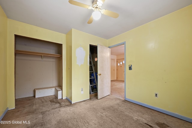 unfurnished bedroom with a ceiling fan, a closet, and baseboards