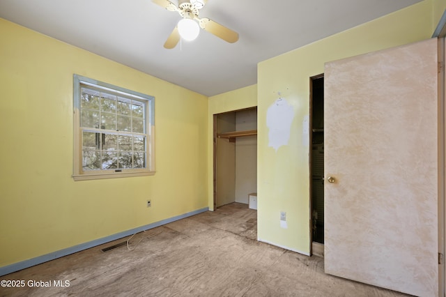 unfurnished bedroom with a ceiling fan, a closet, and baseboards