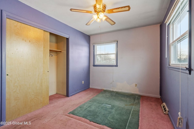 bedroom featuring carpet flooring, baseboards, visible vents, and a closet