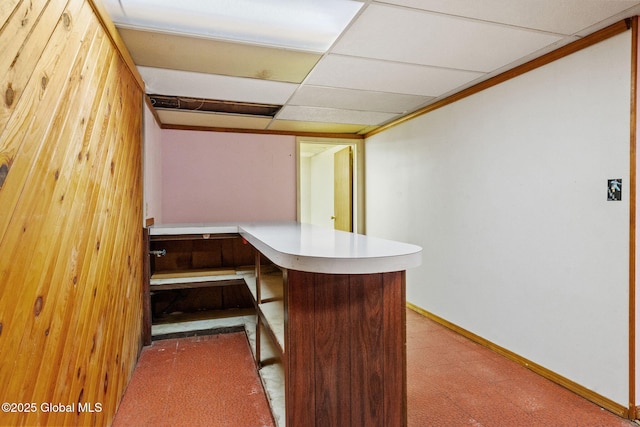 bar with carpet, baseboards, and a drop ceiling