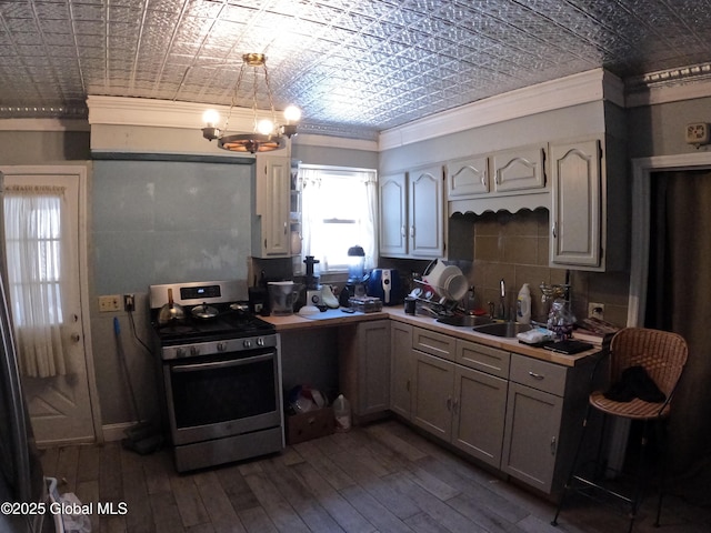 22 Orr St, Troy, NY 12180 - kitchen featuring stainless steel gas range, an ornate ceiling, and ornamental molding