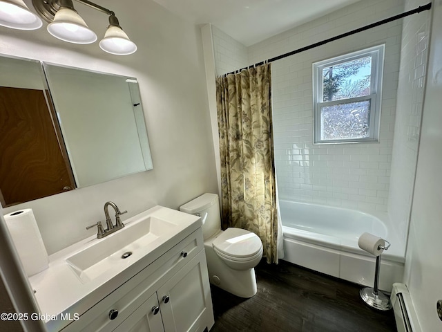 full bathroom with toilet, baseboard heating, shower / tub combo, wood finished floors, and vanity