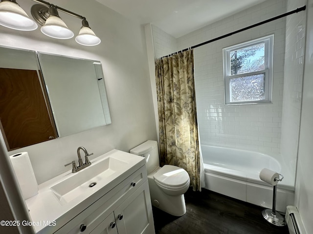 bathroom featuring shower / bathtub combination with curtain, toilet, wood finished floors, baseboard heating, and vanity