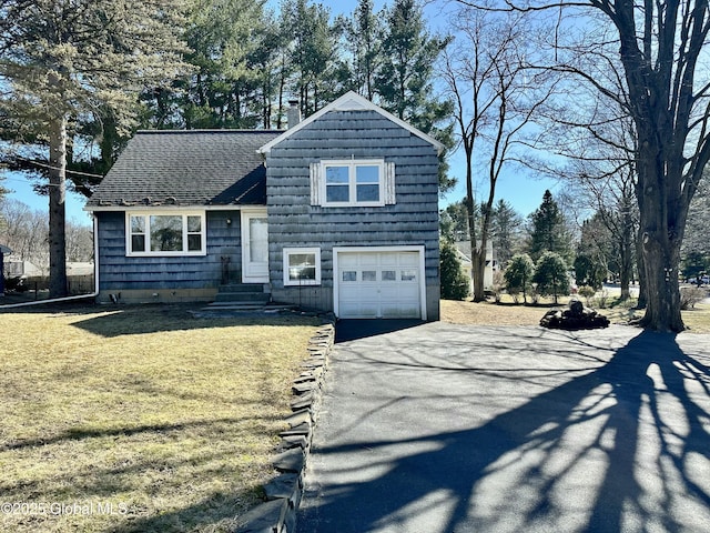 split level home with a front lawn, aphalt driveway, roof with shingles, a chimney, and a garage