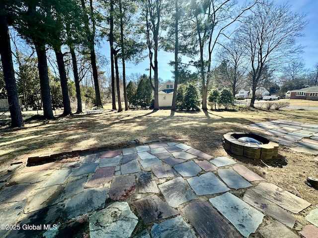 view of patio with an outdoor fire pit