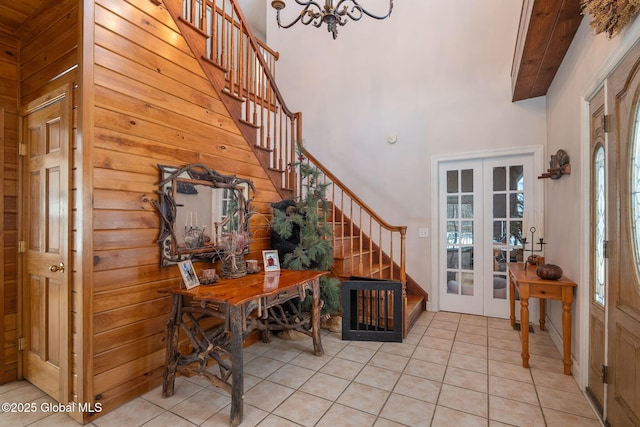 76 Barney Rd, Greenfield, NY 12850 - entrance foyer featuring french doors, stairway, a high ceiling, and healthy amount of natural light