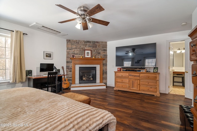 76 Barney Rd, Greenfield, NY 12850 - bedroom featuring dark wood finished floors, a fireplace, multiple windows, and an AC wall unit