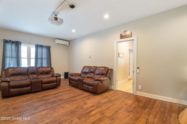76 Barney Rd, Greenfield, NY 12850 - living area with an AC wall unit, wood finished floors, recessed lighting, and baseboards