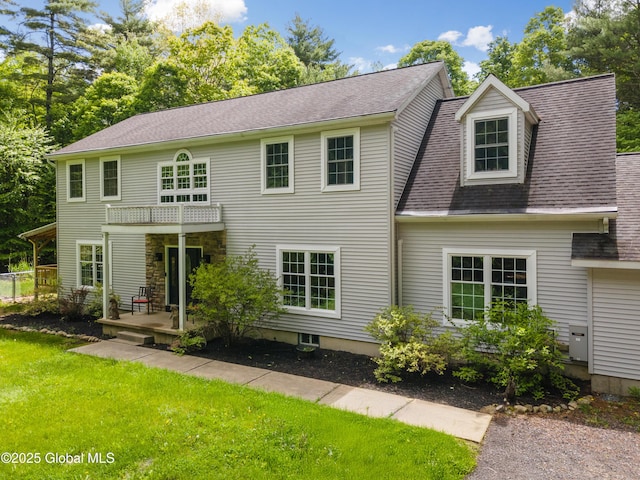 76 Barney Rd, Greenfield, NY 12850 - view of front facade with a front yard, a shingled roof, and a balcony