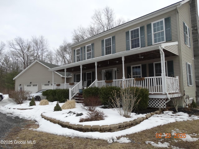 view of front of house featuring a garage and a porch