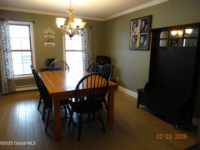 dining space featuring ornamental molding, wood finished floors, and a wealth of natural light