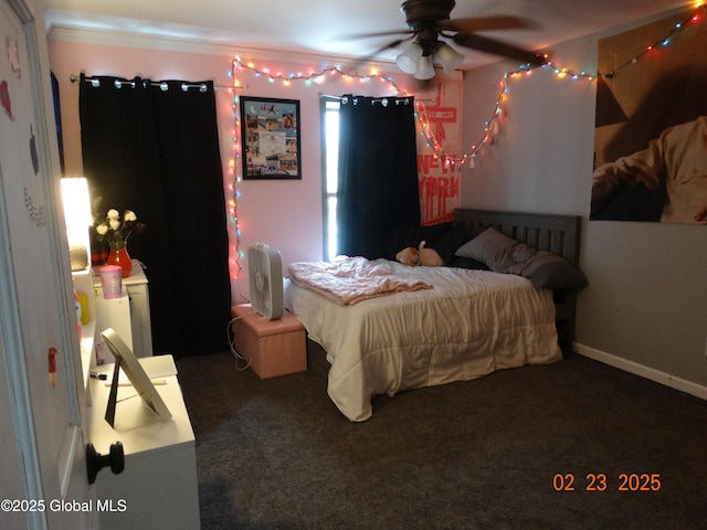 bedroom featuring dark colored carpet and baseboards