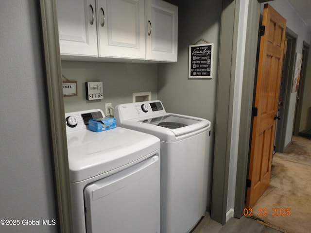 laundry area with cabinet space and washer and dryer