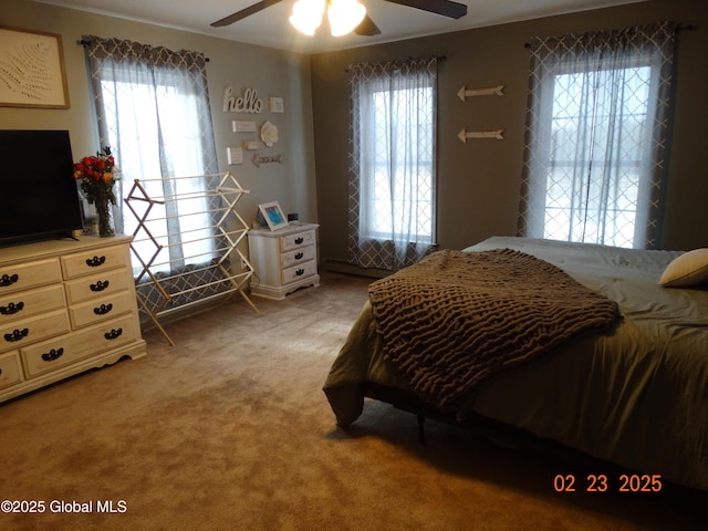 carpeted bedroom featuring ceiling fan