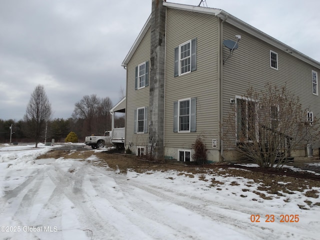 view of snow covered property