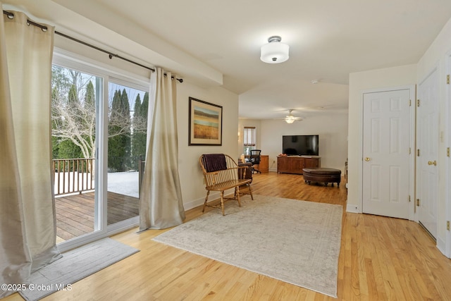 doorway to outside with light wood-style flooring and baseboards