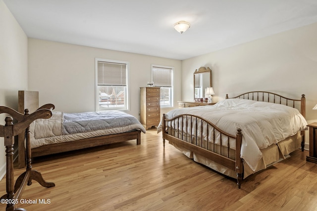 bedroom featuring light wood-style flooring