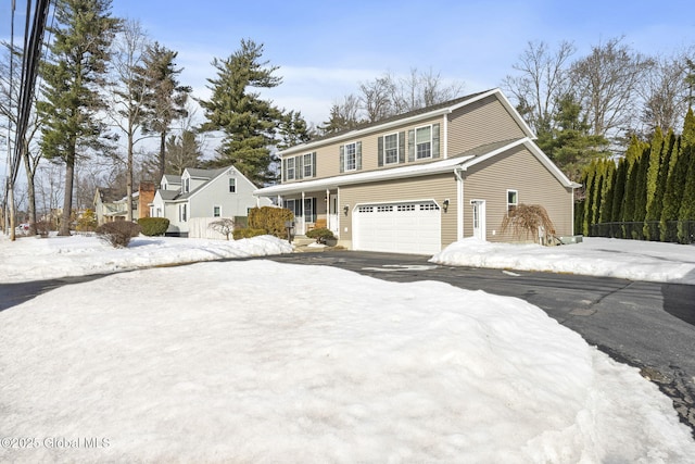 view of front of property featuring driveway and an attached garage