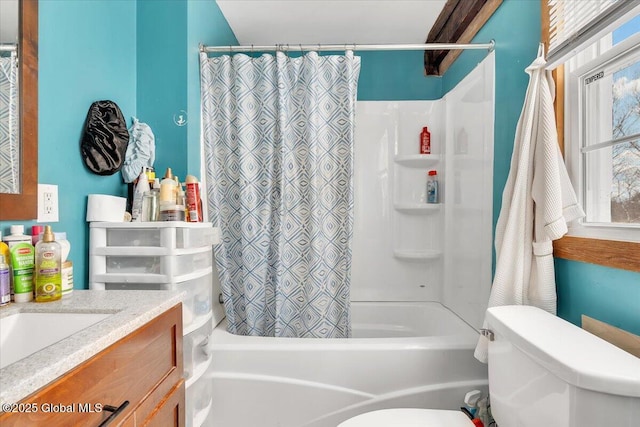bathroom with shower / tub combo, vanity, and toilet