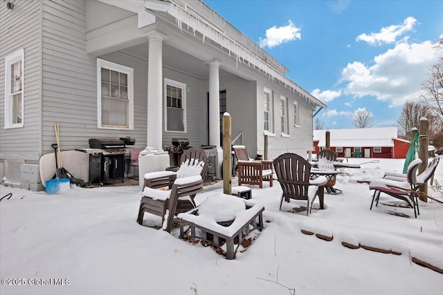 view of snow covered patio