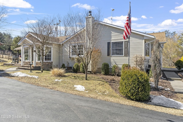 view of front of home featuring a chimney