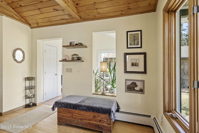 bedroom with lofted ceiling, wood ceiling, multiple windows, and hardwood / wood-style floors