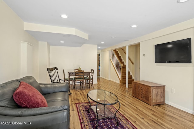 living room with stairs, baseboards, wood finished floors, and recessed lighting