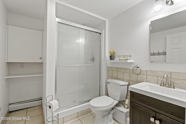 full bath with tile walls, a baseboard radiator, a stall shower, vanity, and tile patterned flooring