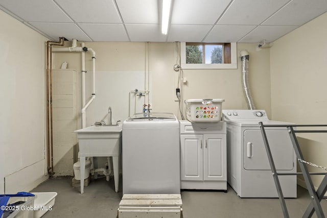 washroom with cabinet space and separate washer and dryer