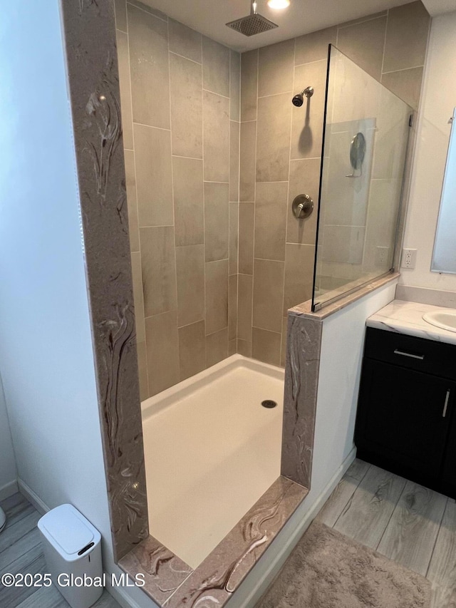 bathroom featuring vanity and a walk in shower