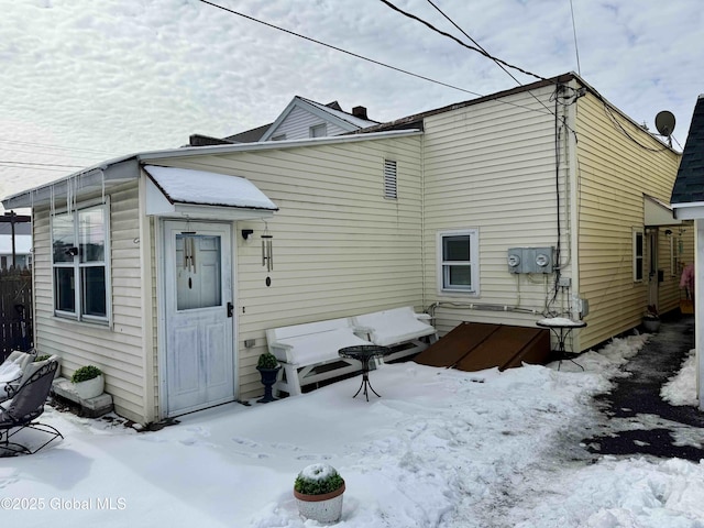 view of snow covered house