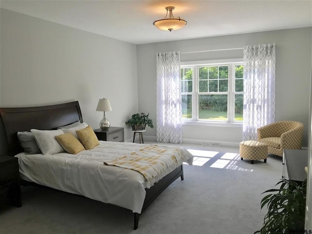 bedroom featuring visible vents and carpet flooring