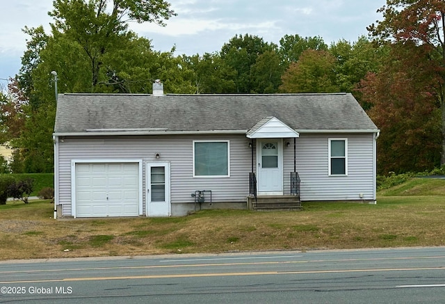 single story home featuring a front lawn, a chimney, driveway, and a shingled roof