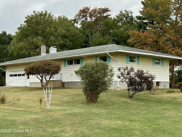 ranch-style house with a garage, a chimney, and a front yard