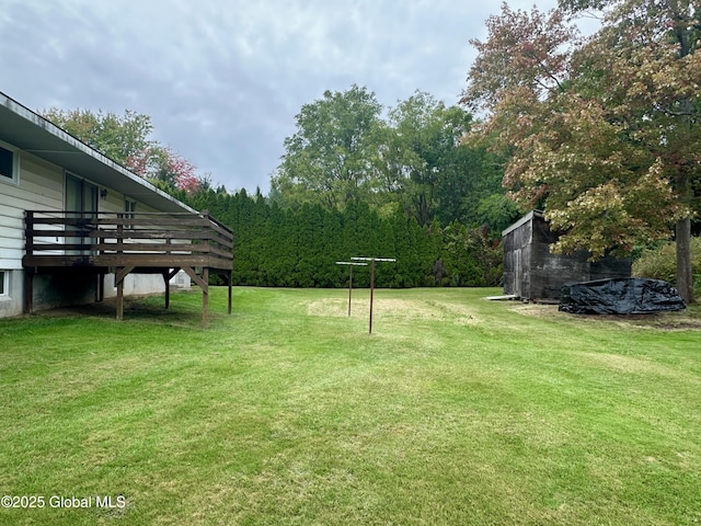 view of yard with a wooden deck