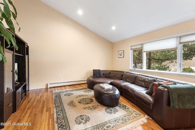 living room with a baseboard heating unit, high vaulted ceiling, light wood-style flooring, and recessed lighting