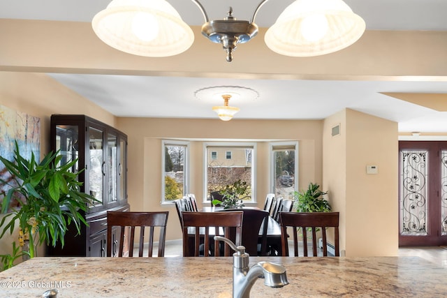 dining room with visible vents