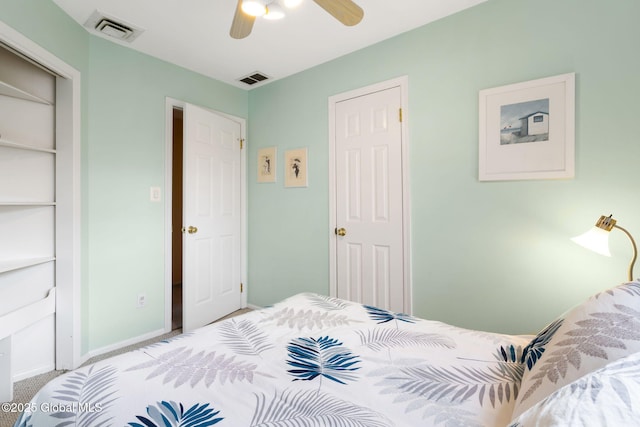 carpeted bedroom with baseboards, visible vents, and ceiling fan