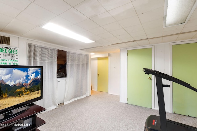 exercise area featuring carpet, visible vents, and washer / clothes dryer