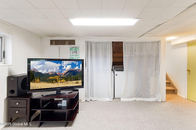 living room with carpet, visible vents, stairway, and washer / clothes dryer