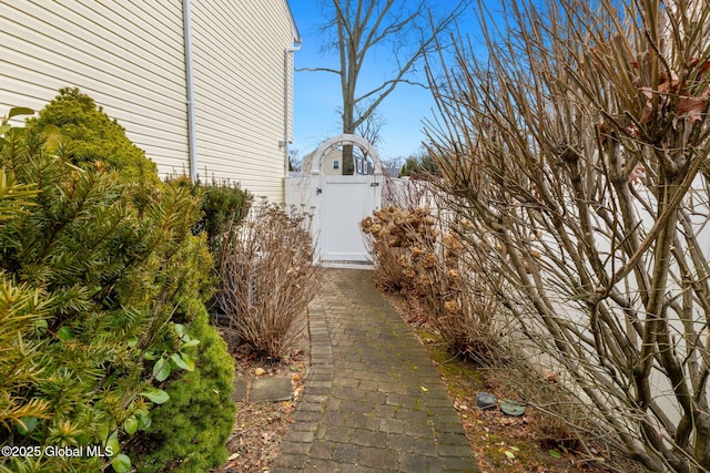 view of property exterior featuring a gate