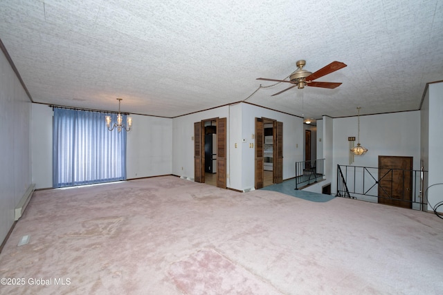 carpeted empty room with ceiling fan with notable chandelier, a baseboard heating unit, ornamental molding, and a textured ceiling