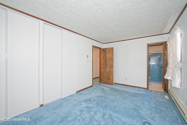 unfurnished bedroom featuring a baseboard radiator, ornamental molding, ensuite bathroom, and light colored carpet