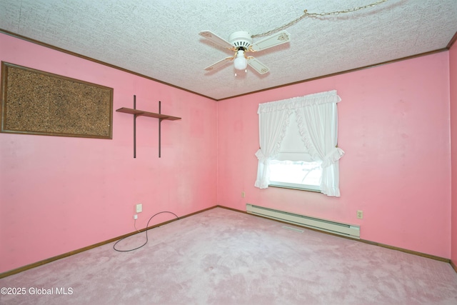 empty room featuring a baseboard heating unit, light colored carpet, a textured ceiling, and ornamental molding