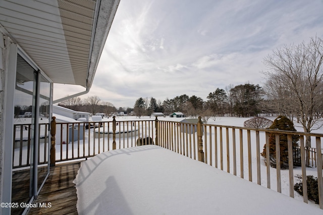 view of snow covered deck